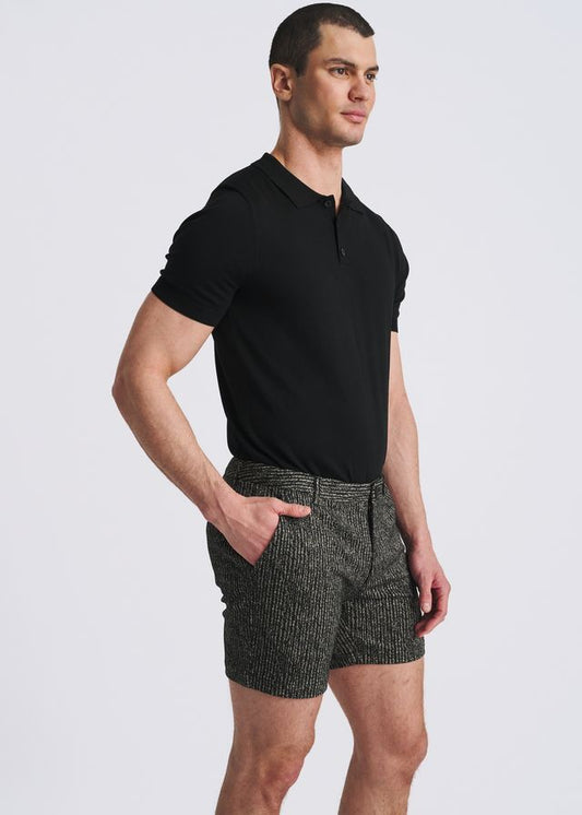 Black chalk stripe jacquard stretch knit chino shorts paired with a black polo.