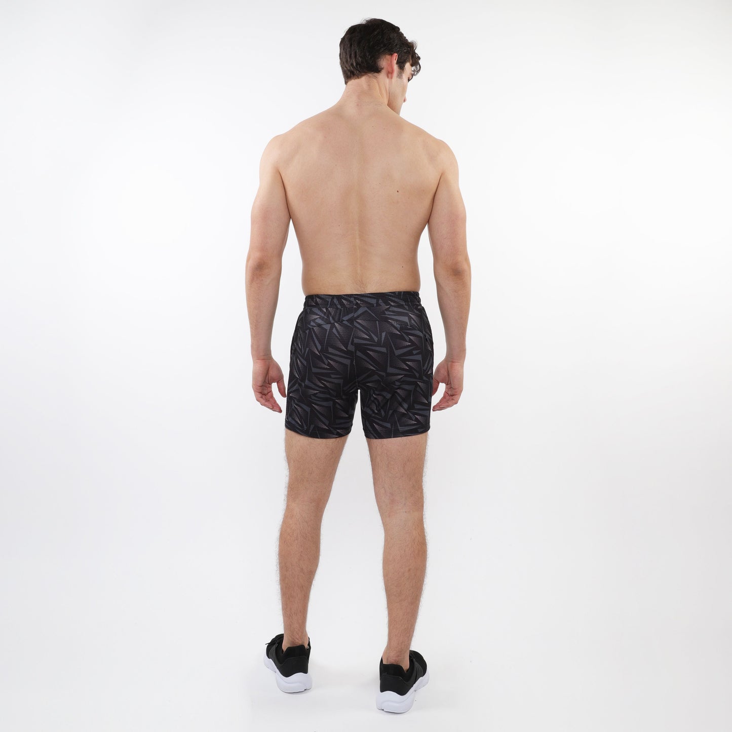 Black printed mesh stretch performance shorts with subtle geometric leaf pattern designed for athletic use