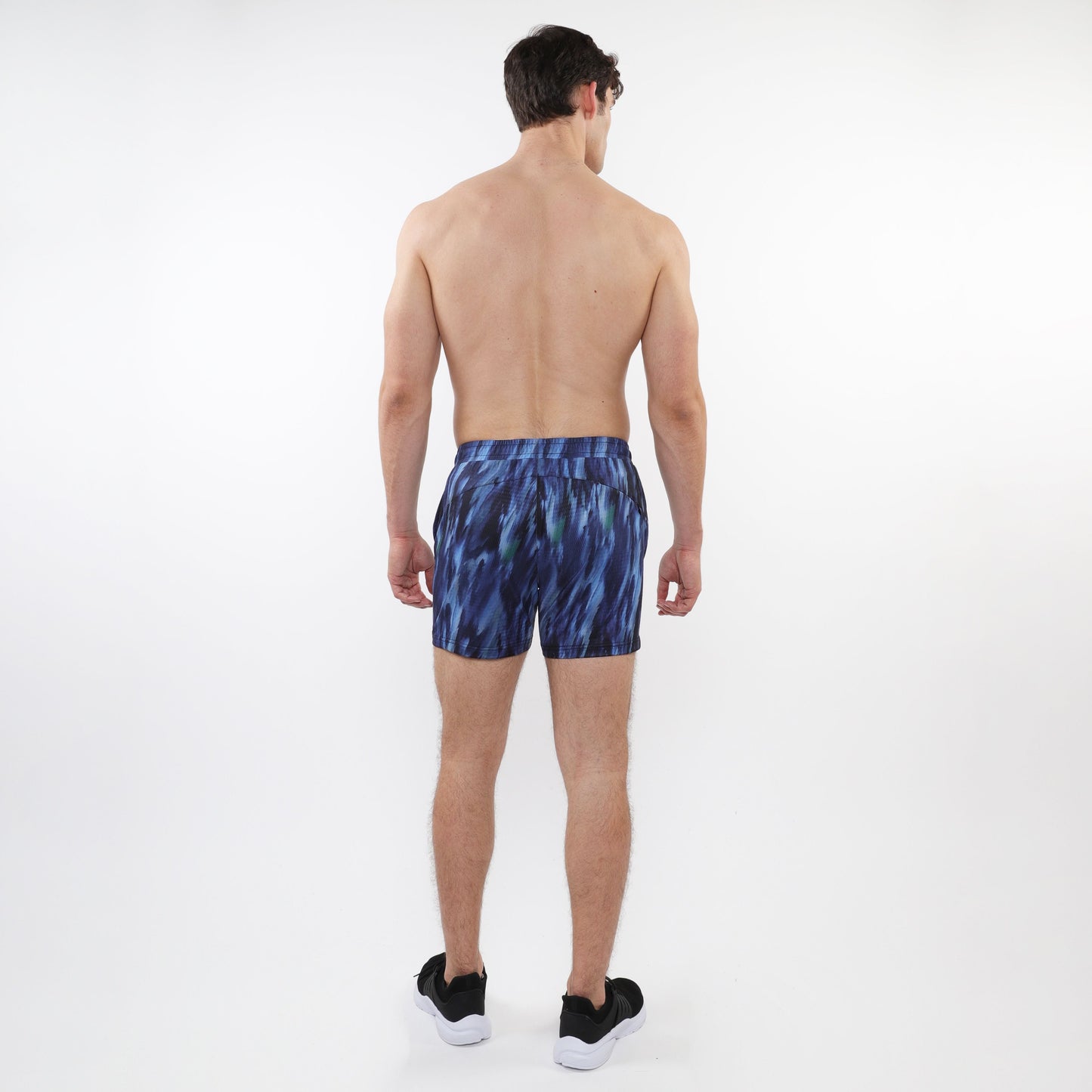 Printed mesh stretch performance shorts in blue with abstract pattern and fitted waistband for athletic use