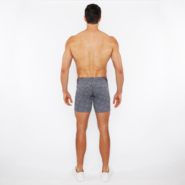 Men’s navy blue printed stretch knit swim trunks with white geometric pattern for comfortable water use