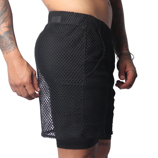 Black athletic shorts in a large-grid fishnet material with a solid inner layer and a branded elastic waistband.