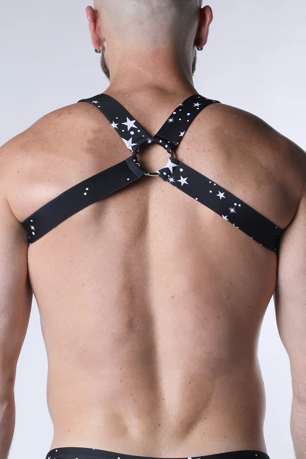 Pulse elastic harness black star-patterned stretchy fabric with white stars and adjustable straps crossing at back