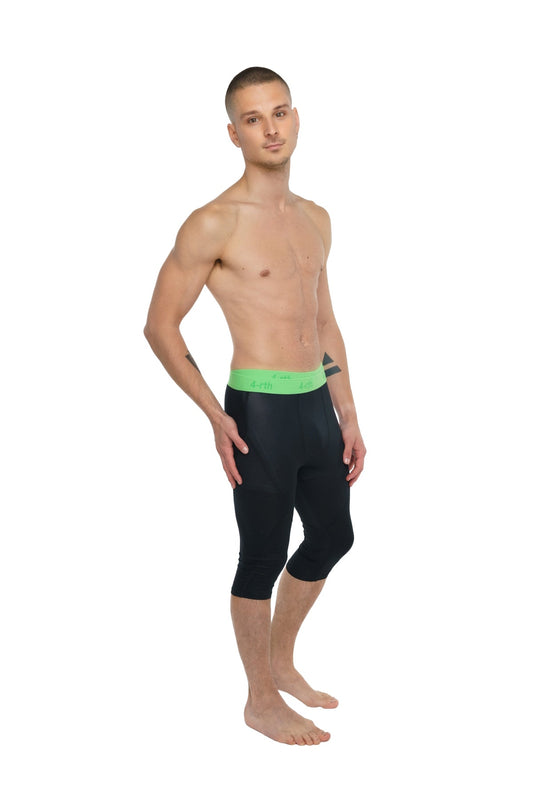 Black capri-length performance yoga leggings in carbon black with a bright green waistband for active wear