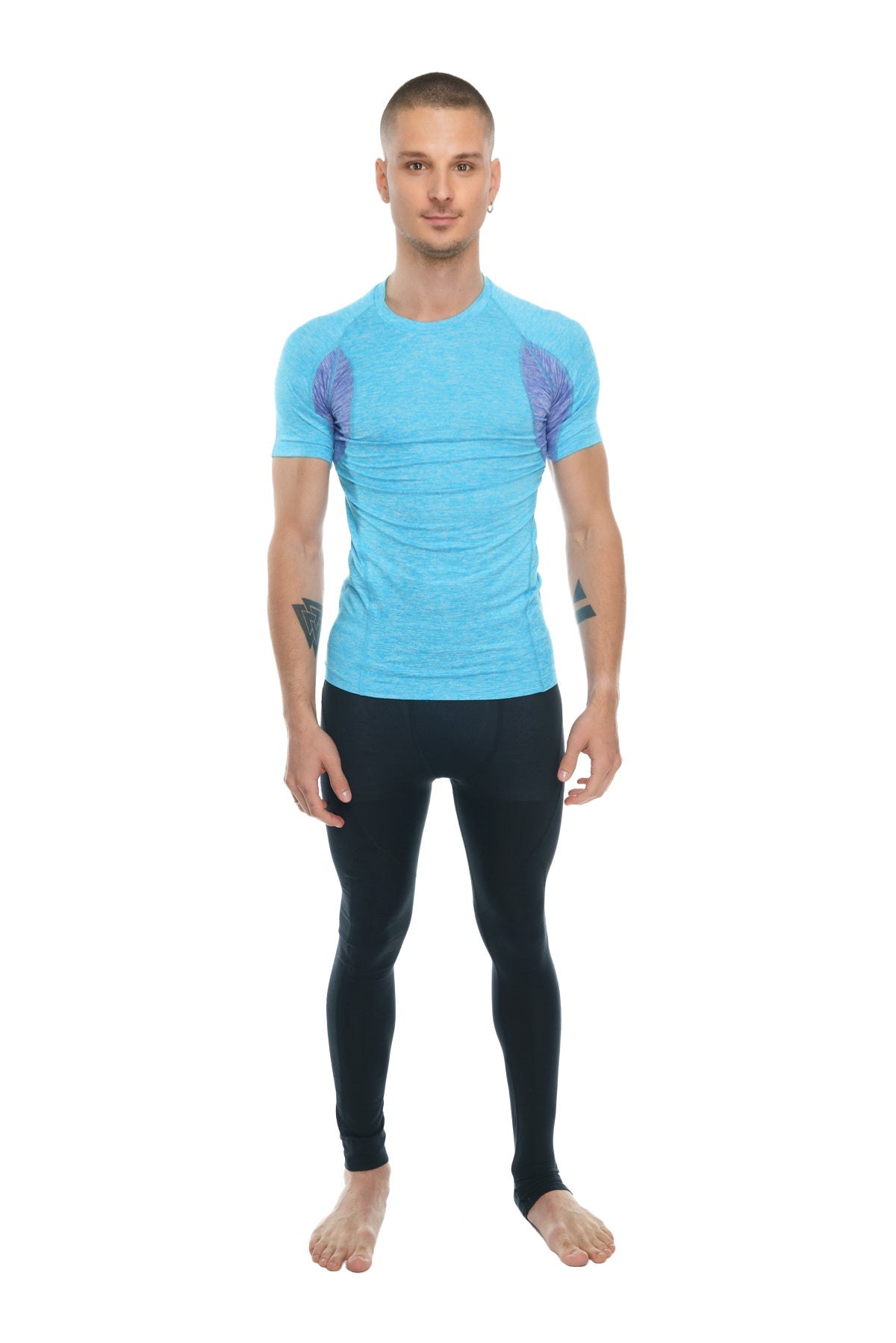 Light blue short-sleeved athletic shirt with purple wing patterns shown with carbon black long performance yoga leggings