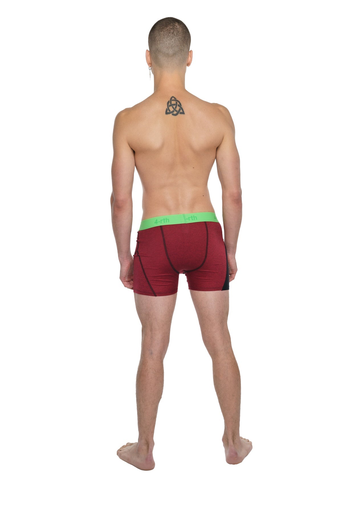 Red athletic briefs with a bright green waistband designed for performance and active use