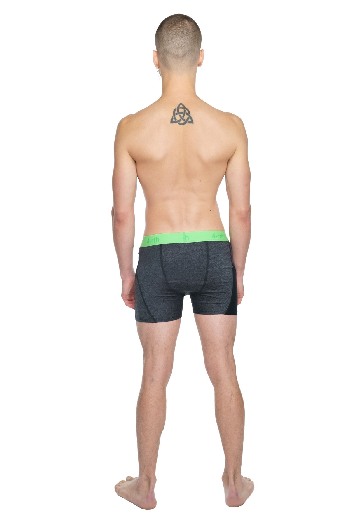 Black athletic boxer briefs with bright green elastic waistband designed for performance and comfort