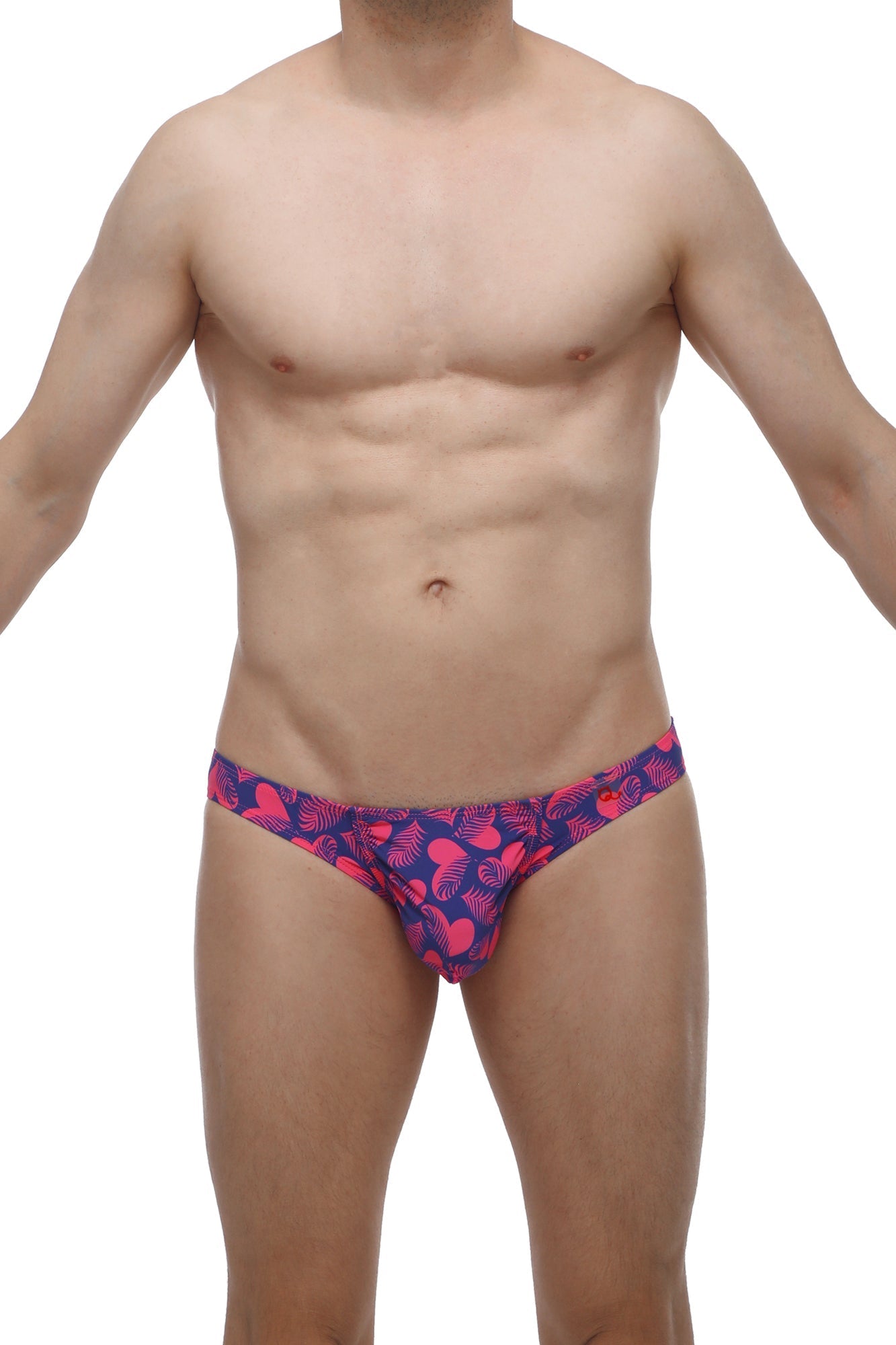 Vibrant pink and navy blue petitq bikini taik tropical hearts swim trunks with tropical leaf pattern for beachwear