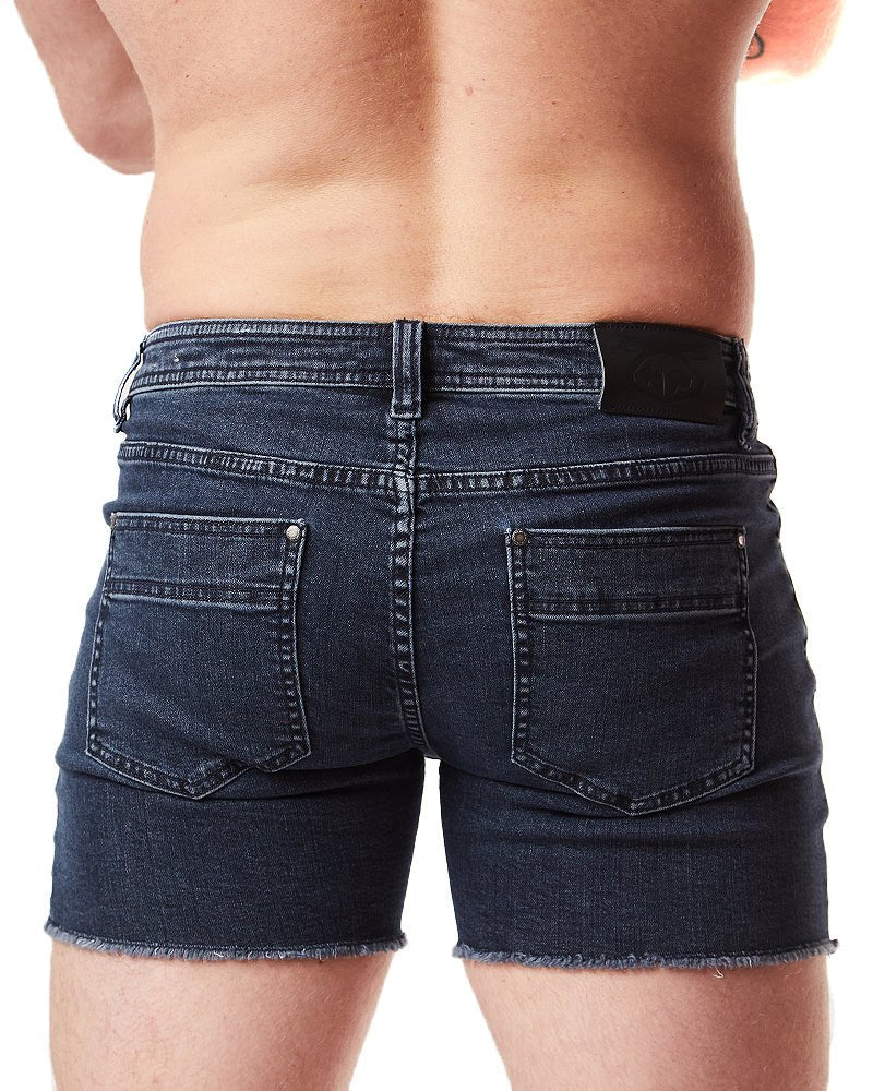 Back view of dark blue denim quad short with frayed hem and functional back pockets