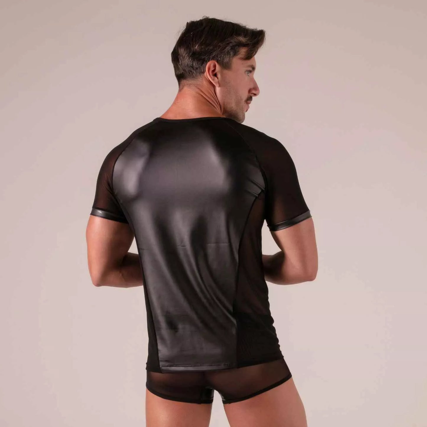 Black rebel t-shirt showing back side with glossy faux leather panel and sheer mesh sleeves and sides