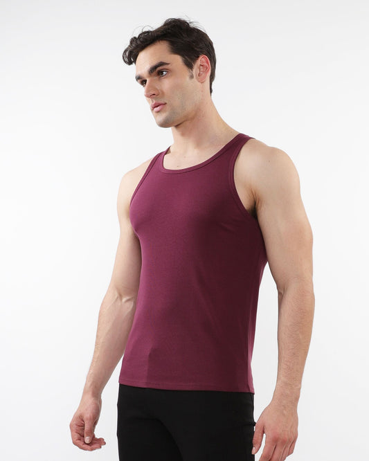 A maroon rib stretch tencel cotton sleeveless tank top with a round neckline and smooth form fitting fabric