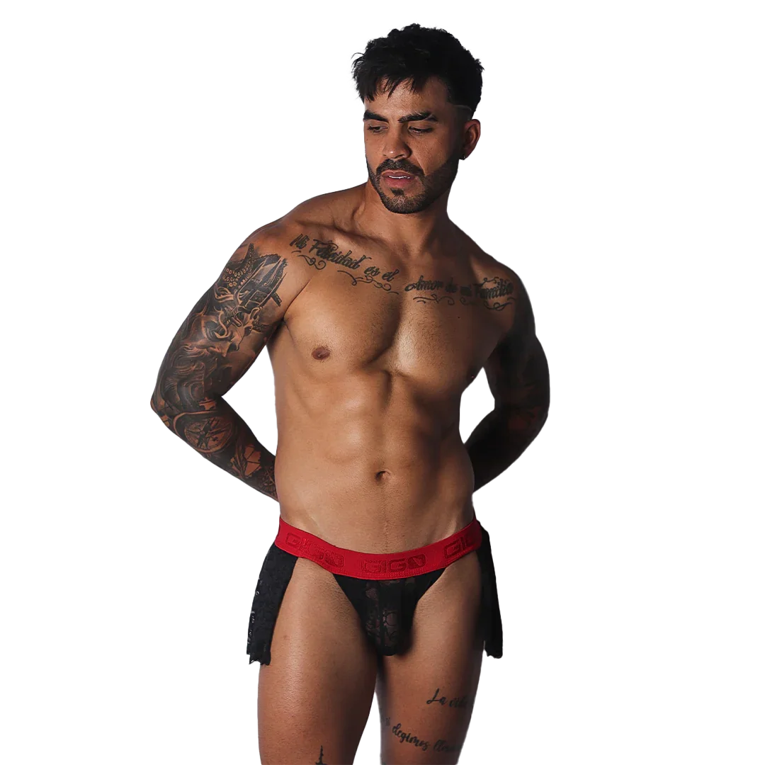 Black lace skirt with a bold red, branded elastic waistband worn by a muscular man.