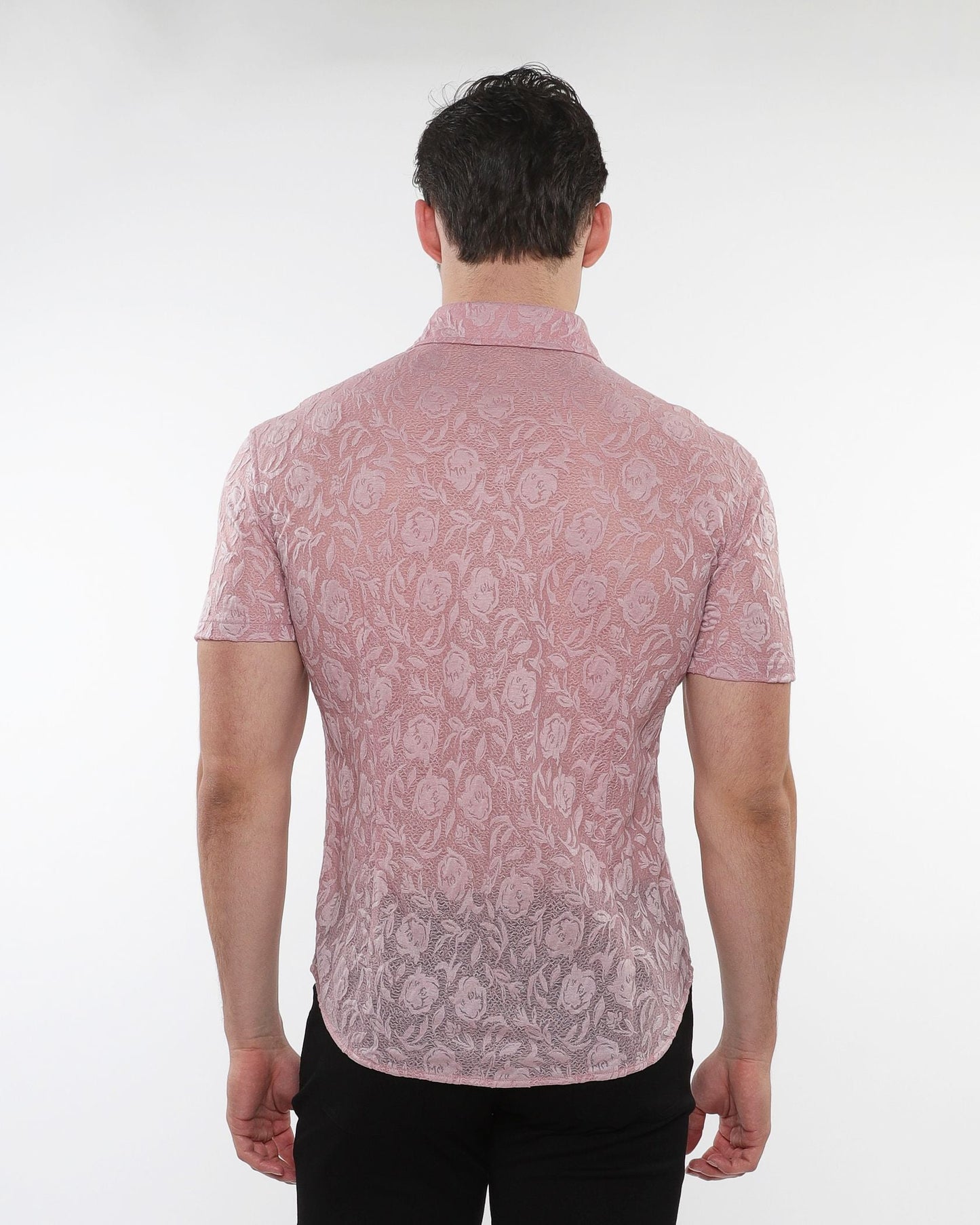 A pink short sleeved roses leaves gossamer knit shirt with a subtle floral lace pattern and button up front