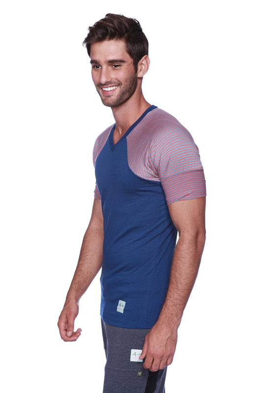 Blue and pink color-blocked v-neck athletic t-shirt featuring raglan sleeves and crew neck design