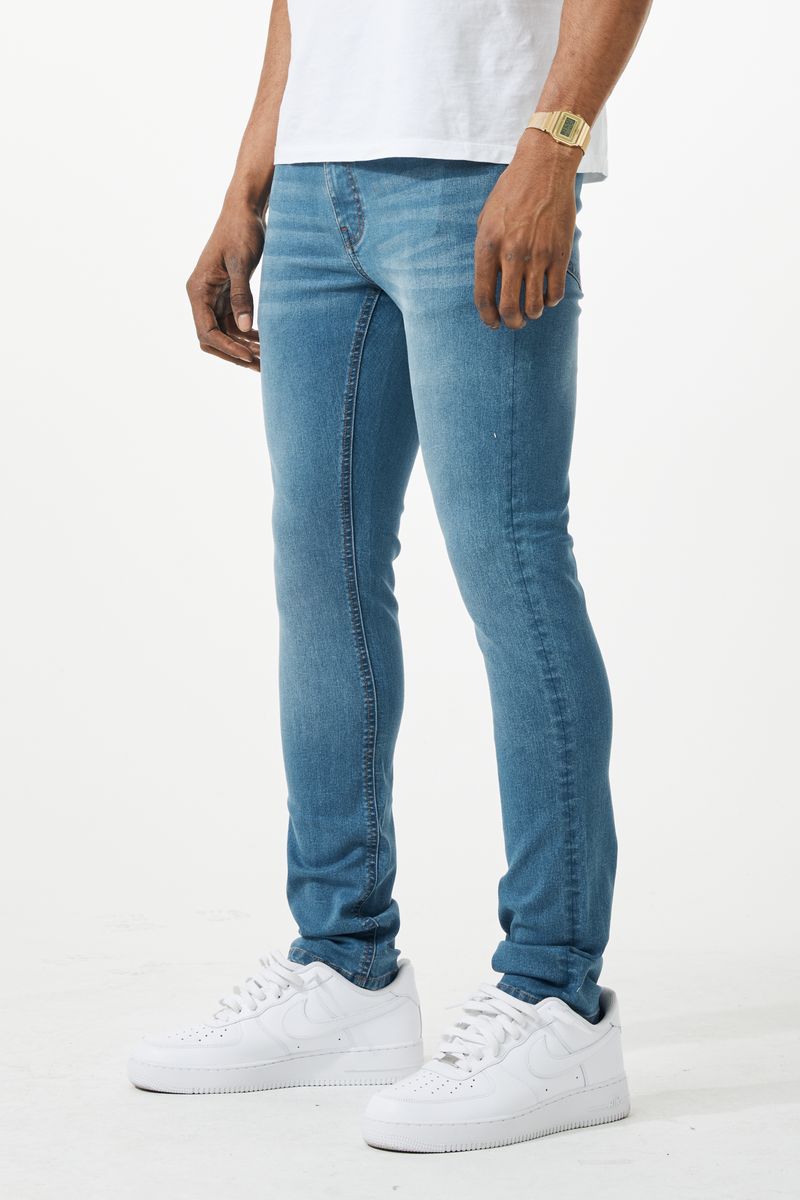 Light-wash blue skinny fit denim jean with classic five-pocket design and subtle fading along the thighs