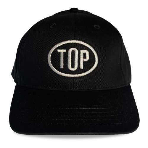 Black spunky monkee cap featuring a white embroidered top logo in an oval on the front panel