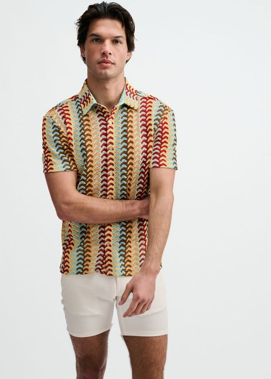 Short-sleeve button-down shirt with a multicolored vertical arrow stripe pattern in red, yellow, blue, and brown.