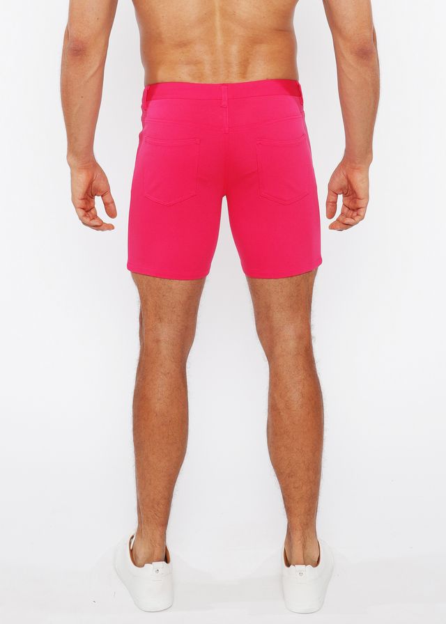 Bright pink stretch knit shorts with fitted waistband and side pockets for athletic use