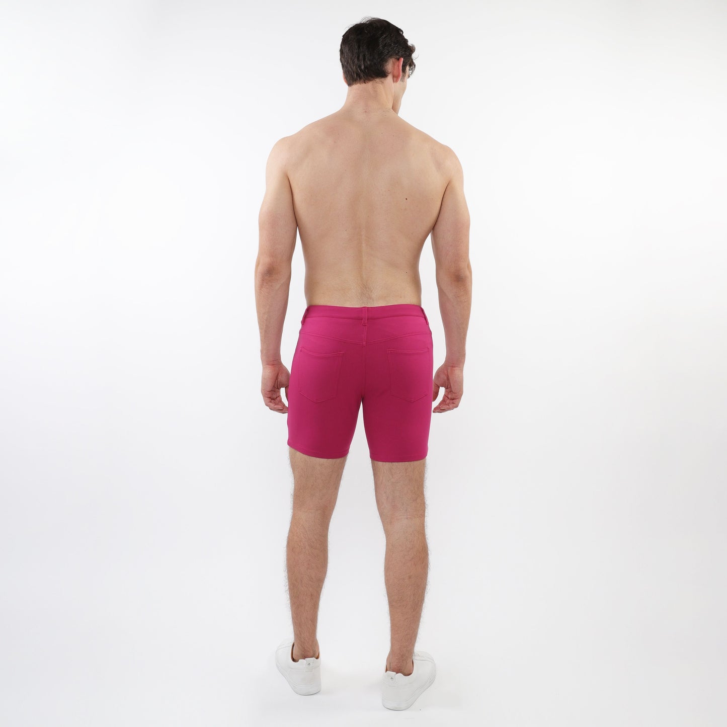Fuchsia stretch knit shorts with fitted cut and elastic waistband designed for athletic use