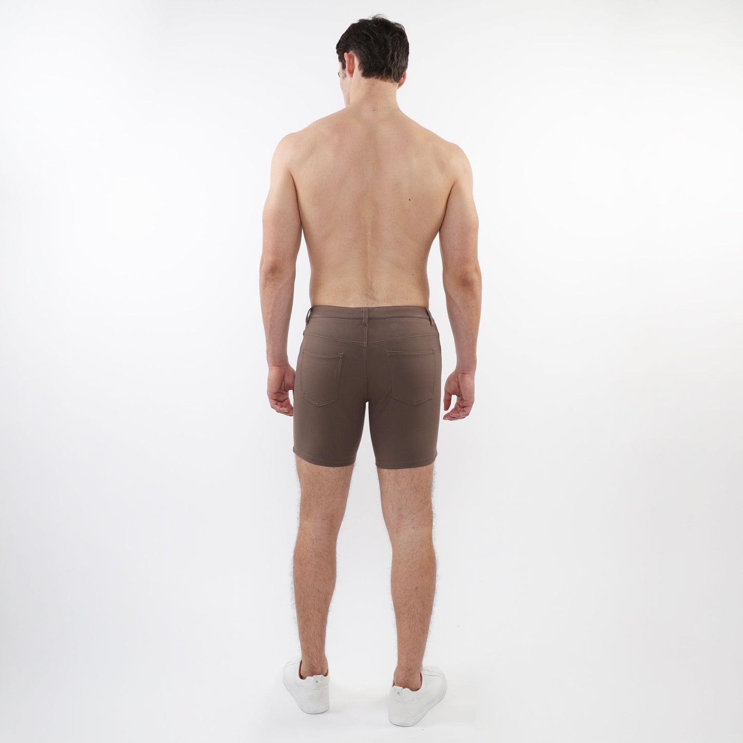Brown stretch knit shorts with tailored fit and two back pockets shown from the back side