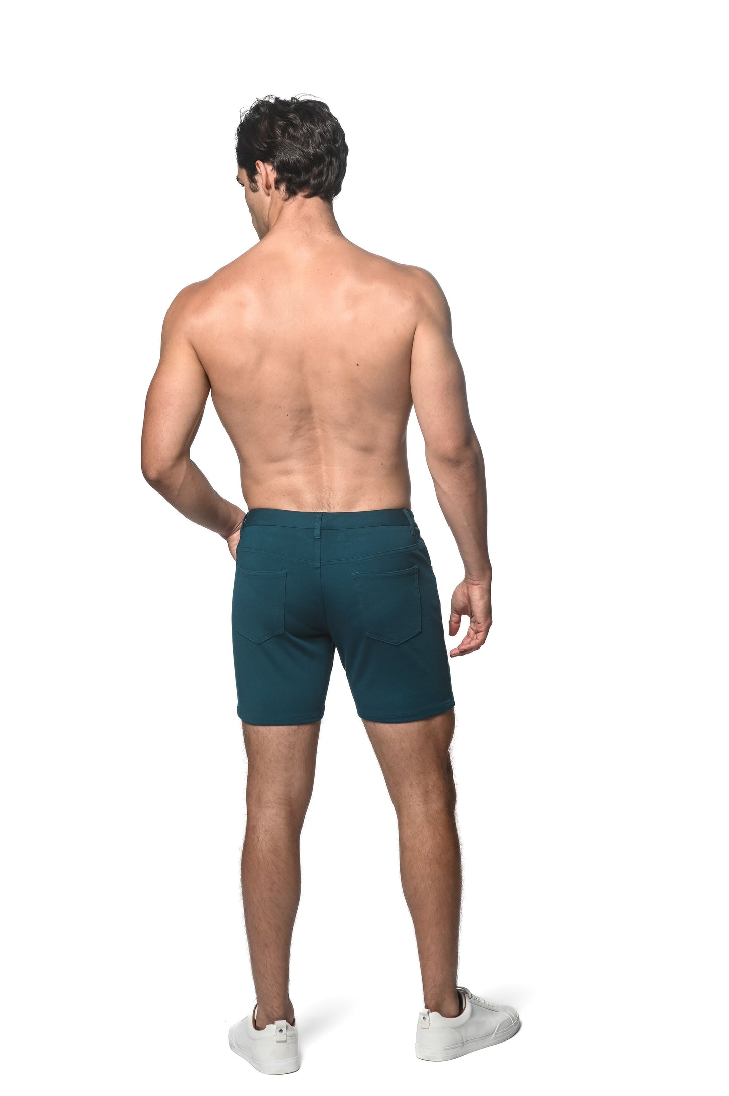 Dark teal stretch knit shorts with sleek modern design and subtle side pockets for athletic use