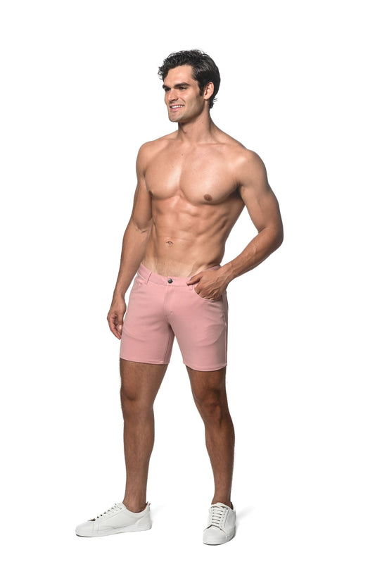 A pair of men’s pink stretch knit chino shorts with a classic five-pocket design and button closure