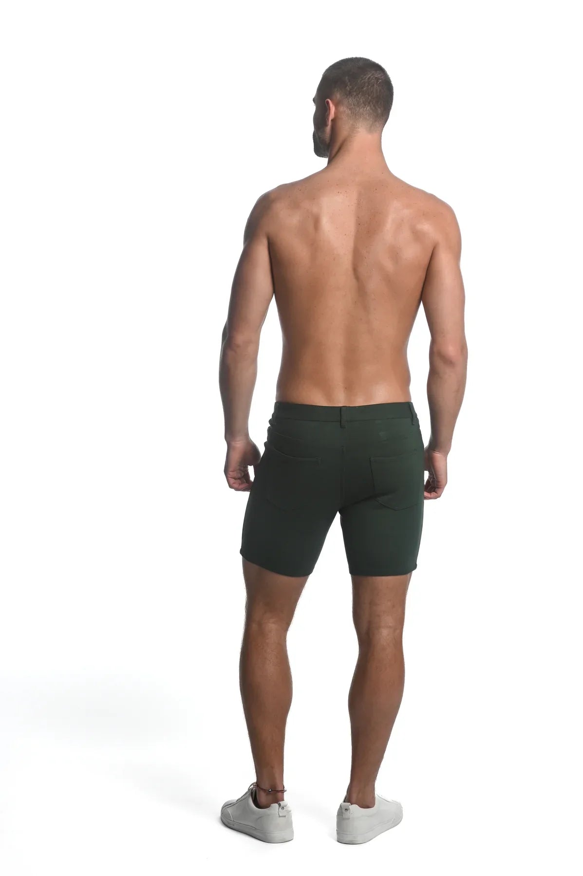 Dark green slim-fit stretch knit shorts made of smooth fabric for comfortable active wear