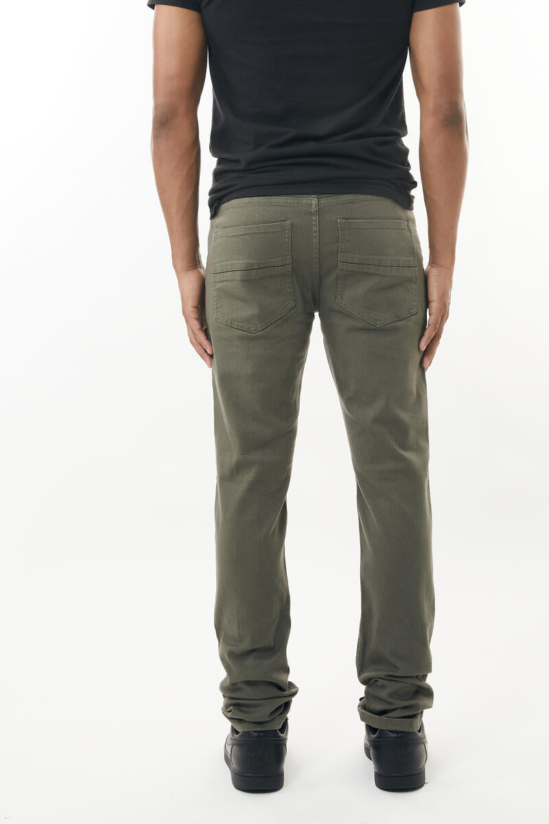 Olive green stretch twill pant with straight-leg fit rear pockets and rolled cuffs shown from the back side