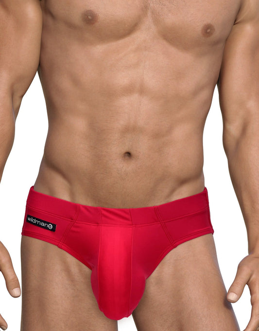 WildmanT Big Boy red swim brief with a contoured pouch and black logo tab on the hip, worn by a fit model.