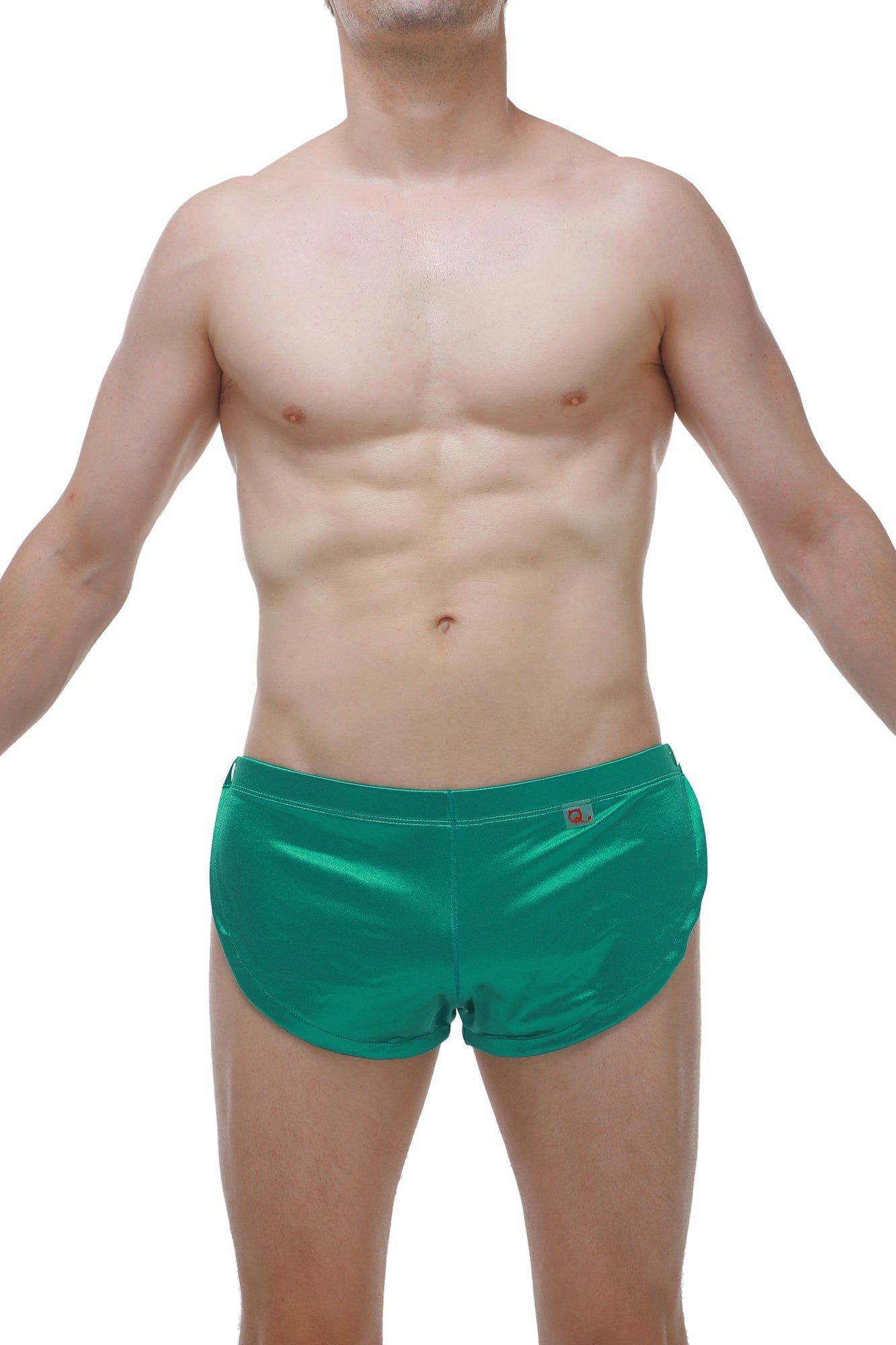 Shiny emerald green satin swim trunks with subtle waistband logo perfect for stylish beachwear and swimming