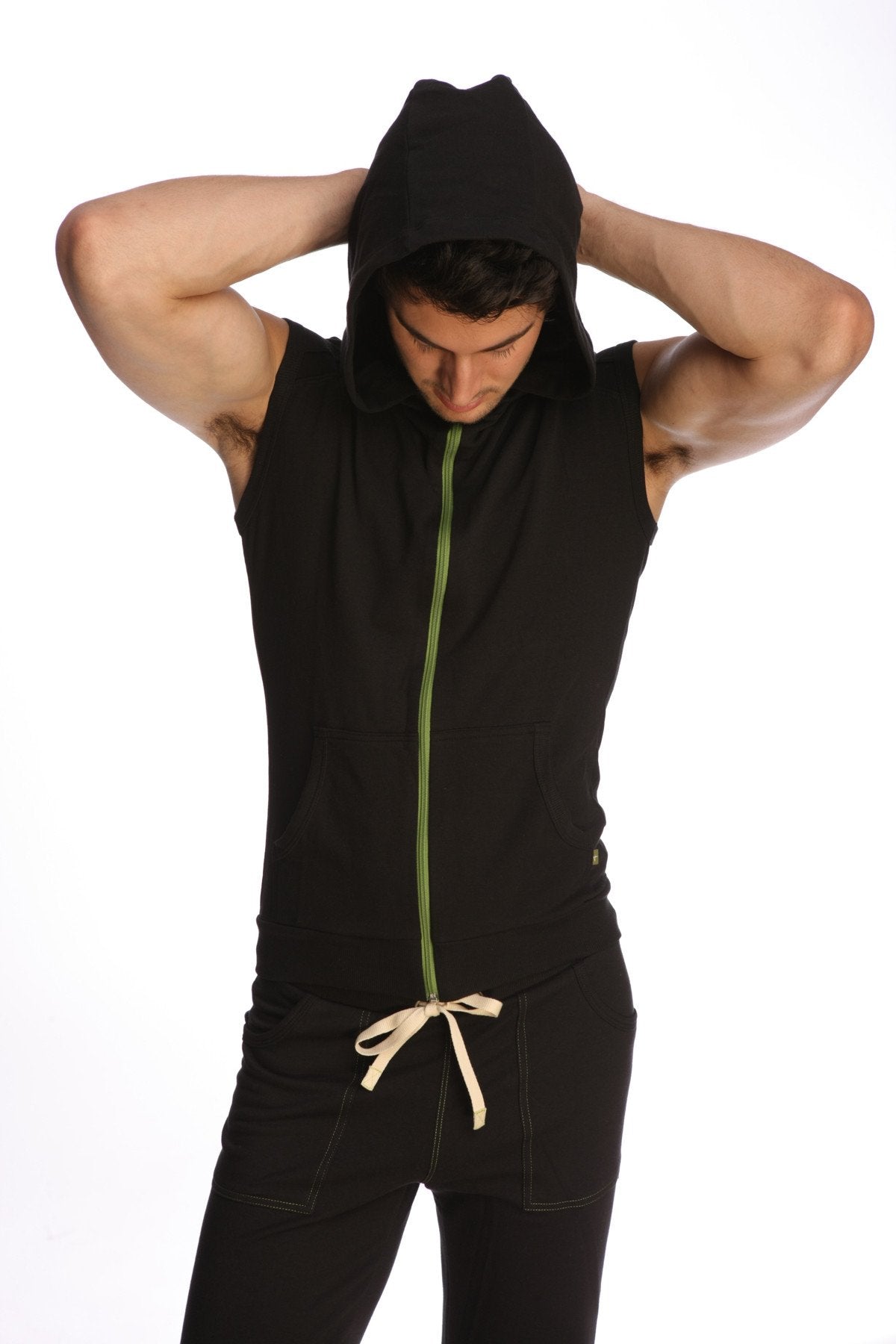 Black sleeveless yoga hoodie with green zipper and beige drawstring waist for comfortable activewear