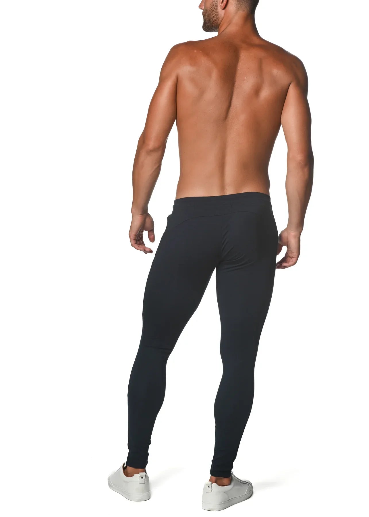 Black tactical gym-tech stretch slim jogger leggings worn by a man showing a form-fitting design