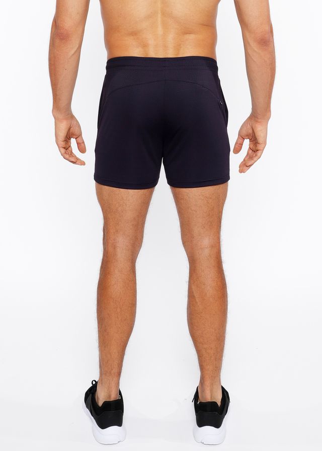 Black textured mesh stretch performance shorts with sleek form fitting design and subtle side pockets
