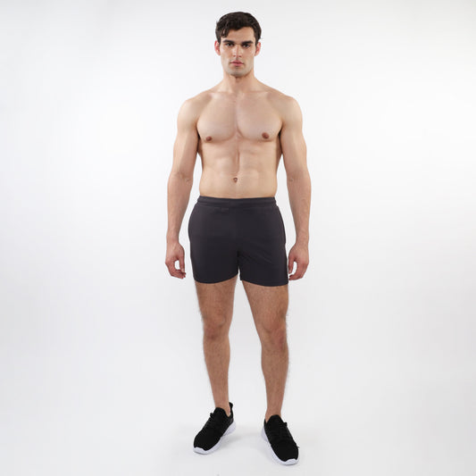Black textured mesh stretch performance shorts with sleek form-fitting design and elastic waistband for athletic use
