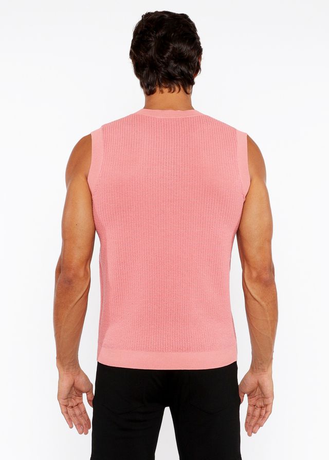A pink ribbed knit sleeveless top with a crew neckline featured in the textured open knit vest collection