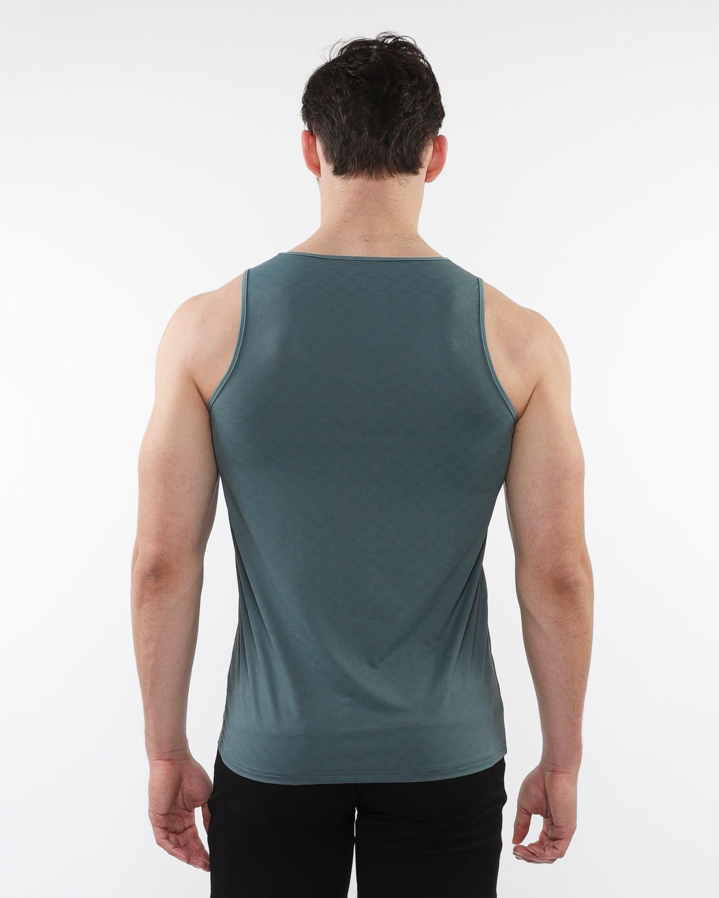 A sleek dark teal sleeveless textured stretch mesh performance tank with smooth form-fitting fabric