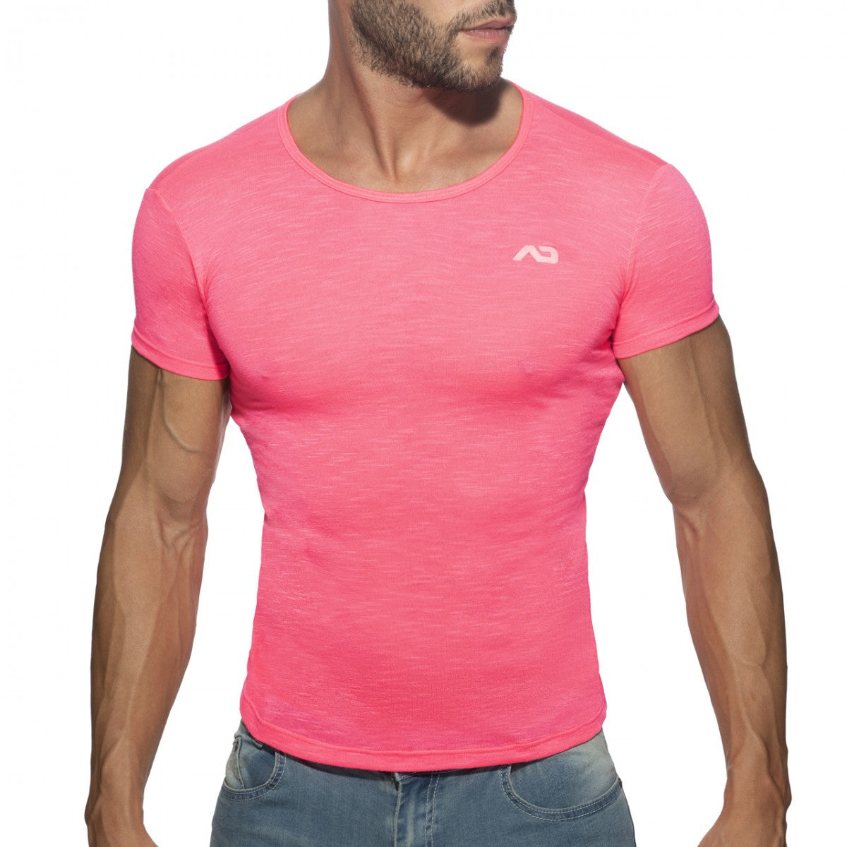 A vibrant pink thin flame t-shirt with short sleeves a subtle heathered texture and a small white logo on the chest