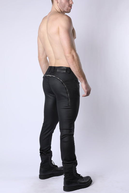 Black leather toro zipper pants with sleek form fitting design and silver zipper along the back seam shown from back side