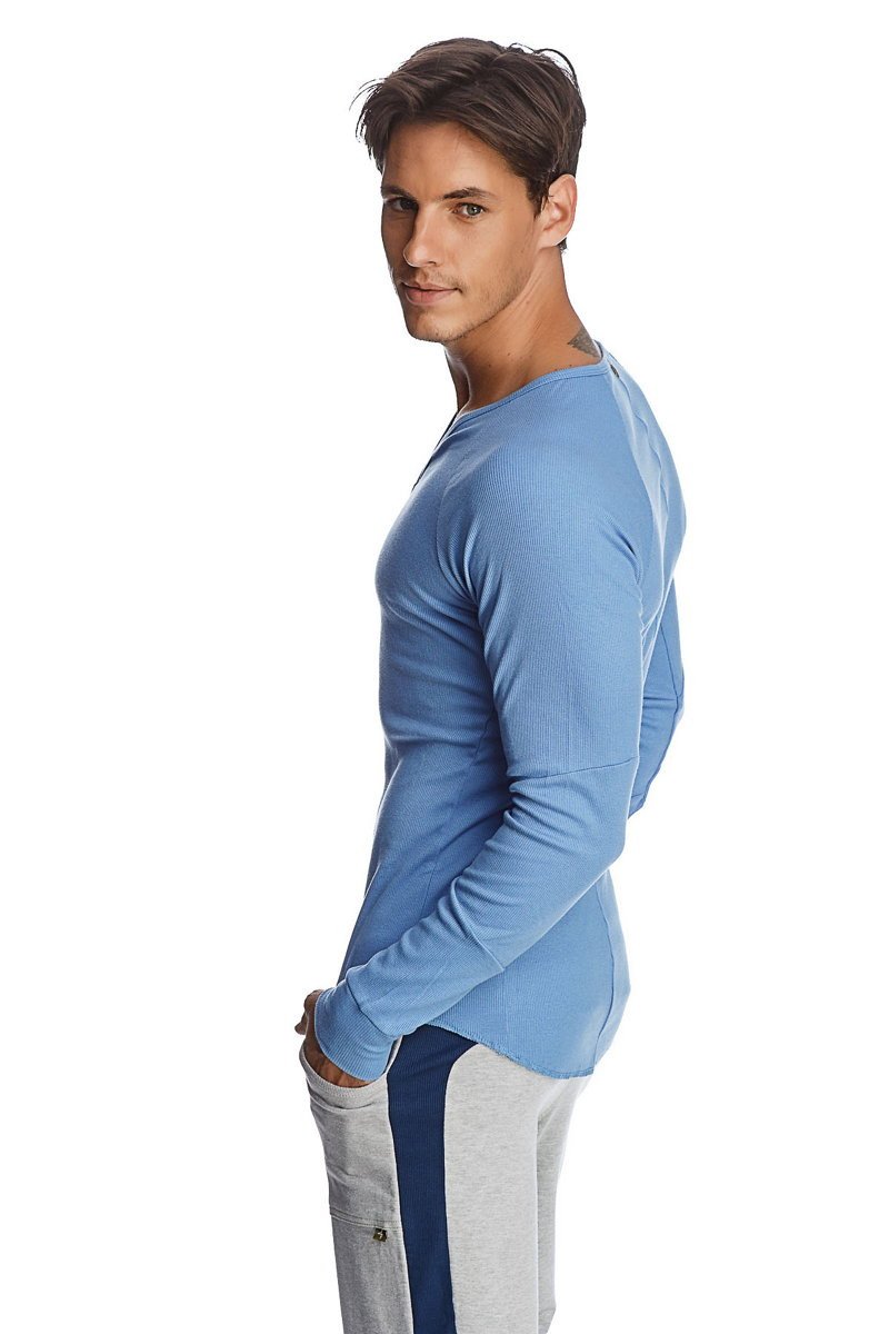 A light blue thermal long sleeve ribbed knit shirt with a rounded neckline and v neck detail