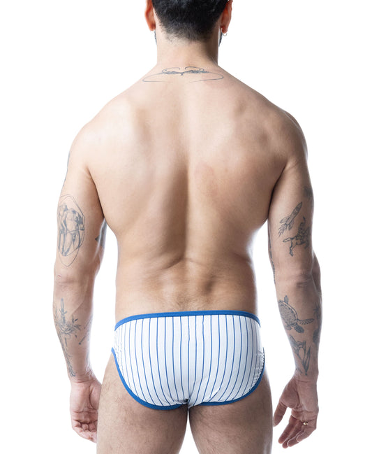 Rear view of a person wearing white low-rise briefs with blue pinstripes and trim, isolated on white.