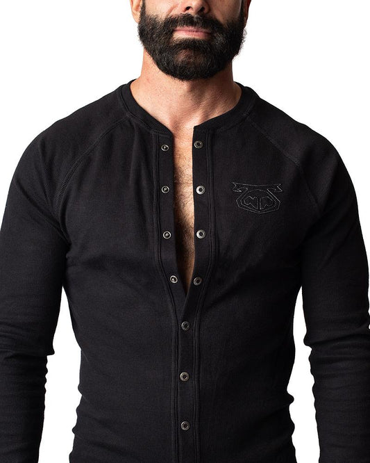 Black ribbed long-sleeve henley shirt union suit with silver buttons and subtle embroidered chest logo