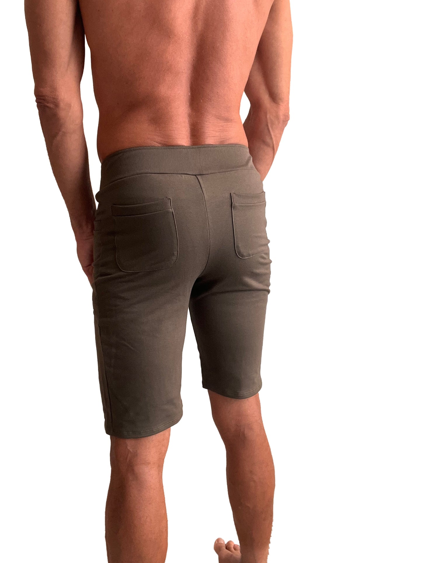 Olive green urban tactical at home dress shorts shown from the back with ribbed waistband and two back pockets