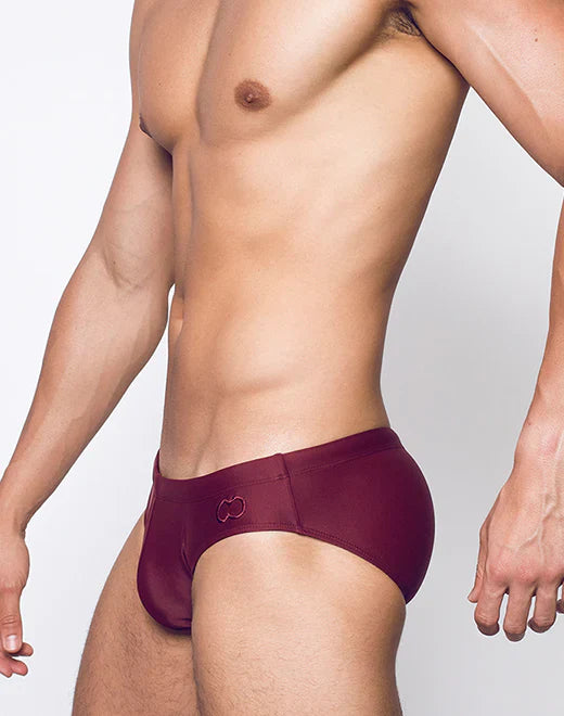 Maroon v10 core bikini swim trunks with subtle logo on waistband designed for active water use