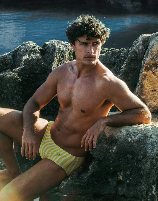 Bright yellow and white striped printed swim sungas in dolce yellow designed for beach and pool use