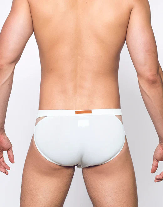 White men’s VB21 blk label swim brief with thin waistband and orange rectangular tag in breathable fabric