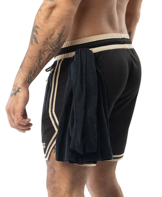 Black warm up rugby shorts with cream stripes and drawstring waistband featuring a side fabric flap tie