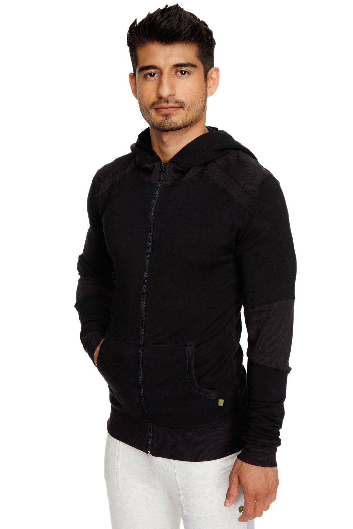 Black mid-weight luxury-fleece zip-up hoodie with subtle contrast panels and green logo for yoga and track use