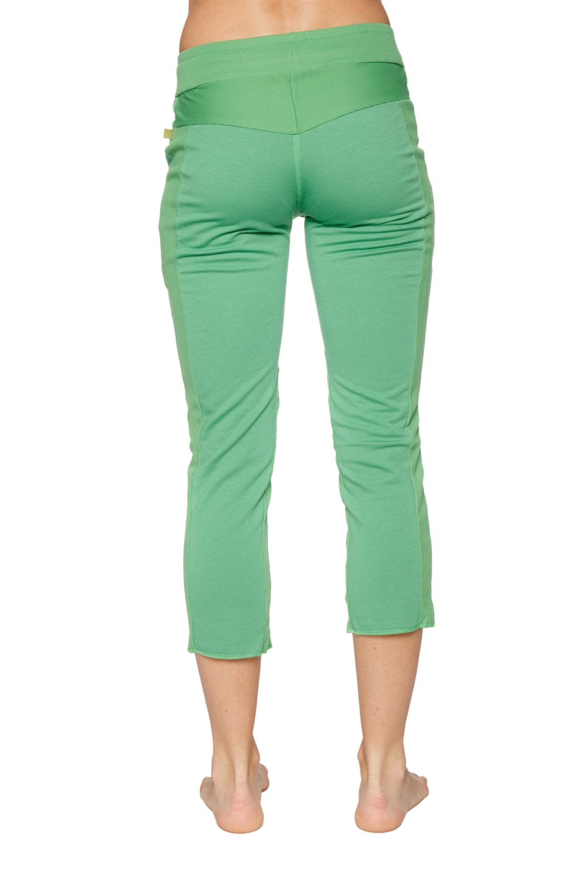 Women’s bamboo green 4/5 length capri yoga pants with high-waisted elastic band and subtle side pockets