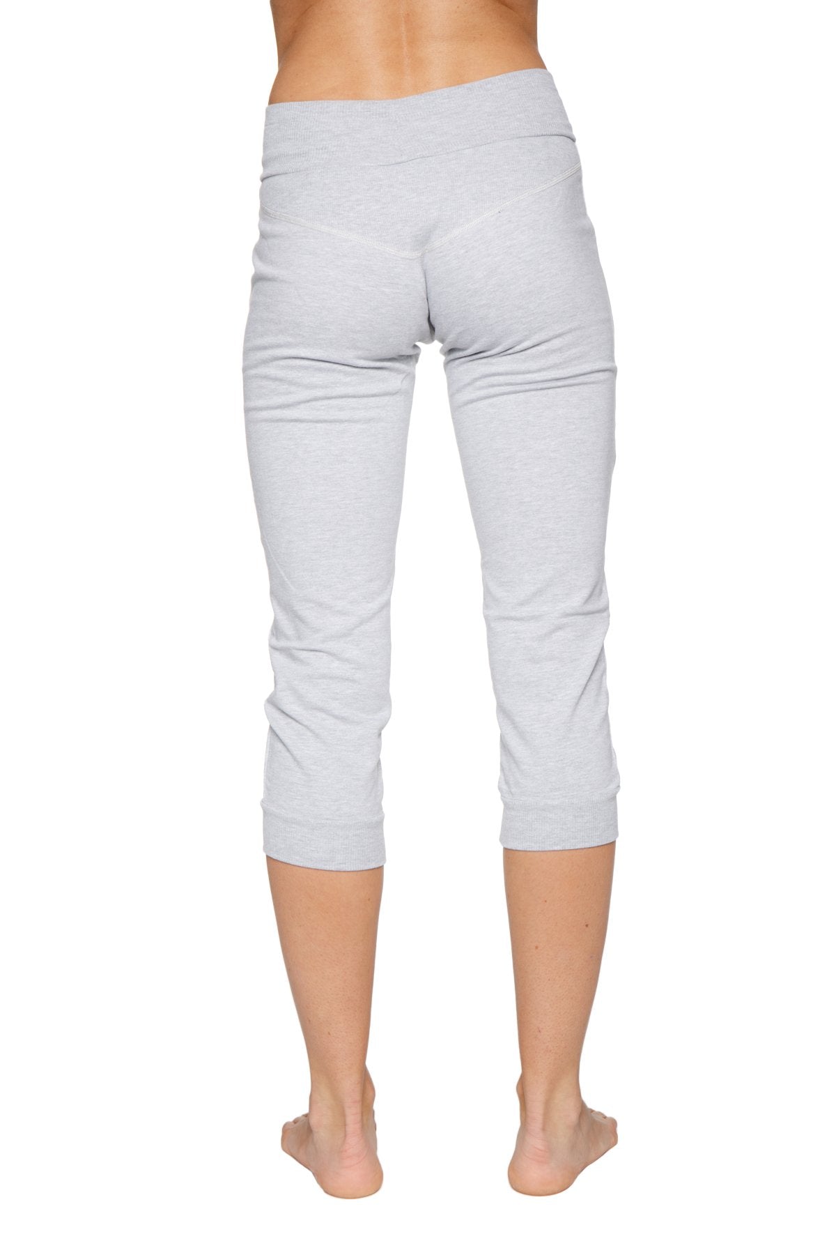 Women’s heather grey cuffed jogger yoga pants in soft stretchy fabric with elastic waistband and capri length