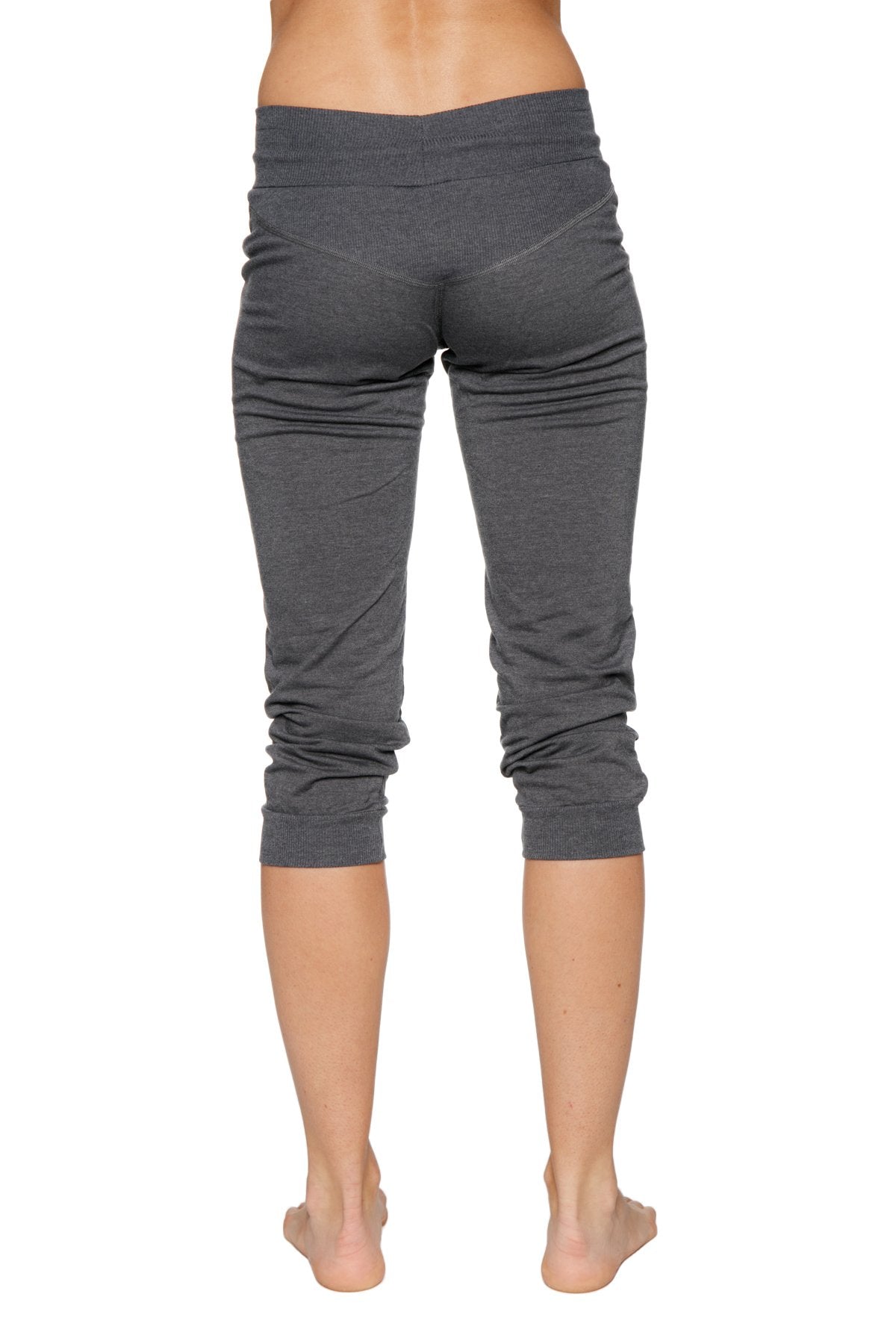 Women’s cuffed jogger yoga pant in solid charcoal with gray stretchy fabric ribbed waistband and rolled cuffs