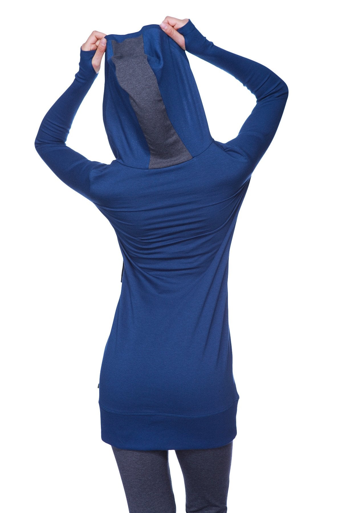 Back view of women’s royal blue long body hoodie top with charcoal gray mesh panel and long sleeves